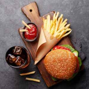 Burge, Fries and Soda with condiments